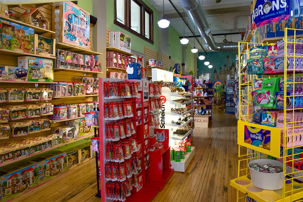 Shelves and display boxes lined with assorted toys in Child's Play Toys.