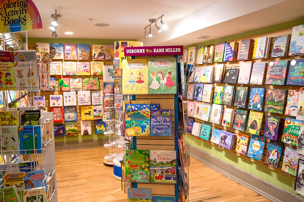 The "book room" in Child's Play Toys, where shelves of books line the walls from top to bottom.
