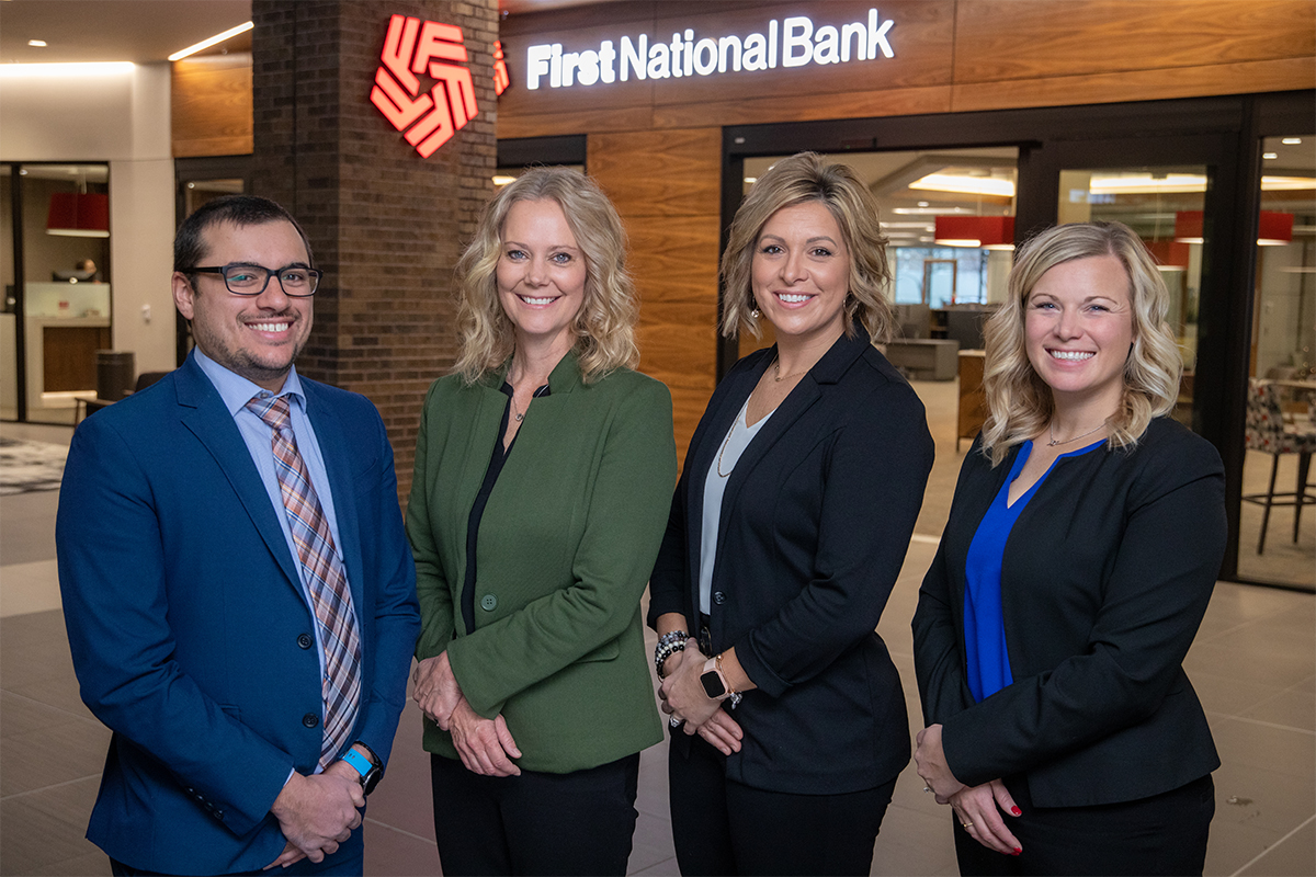 A group photo of mortgage bankers Chase Hoffman, Terri Foster, Jill Salter, and Britt Strum.