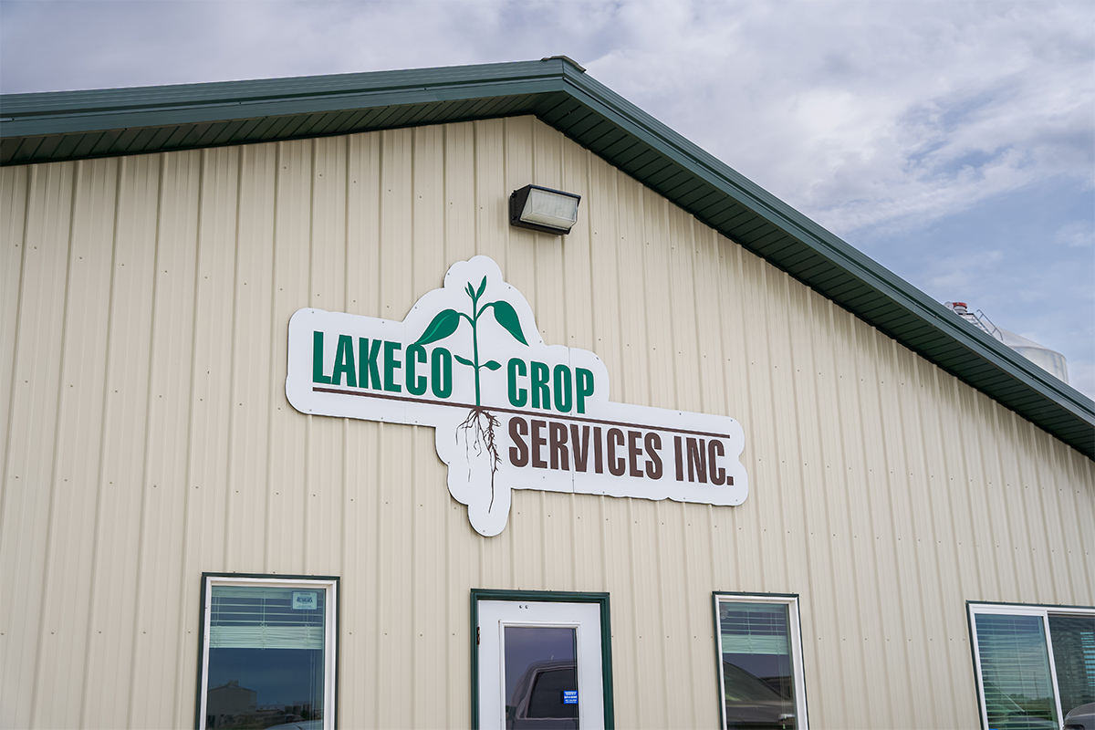 The Lakeco Crop Services sign on the business's warehouse.