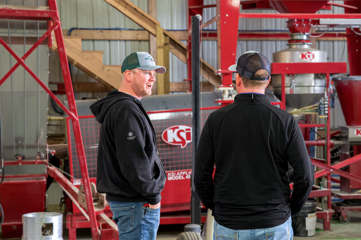 Rob Thuringer discussing crop products with a customer.