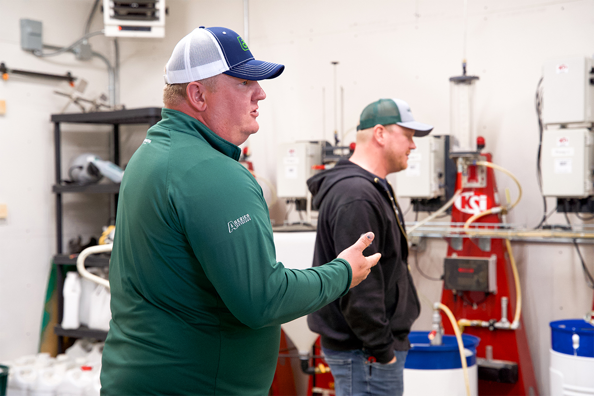 Dave Ellens discussing crop products with a customer.