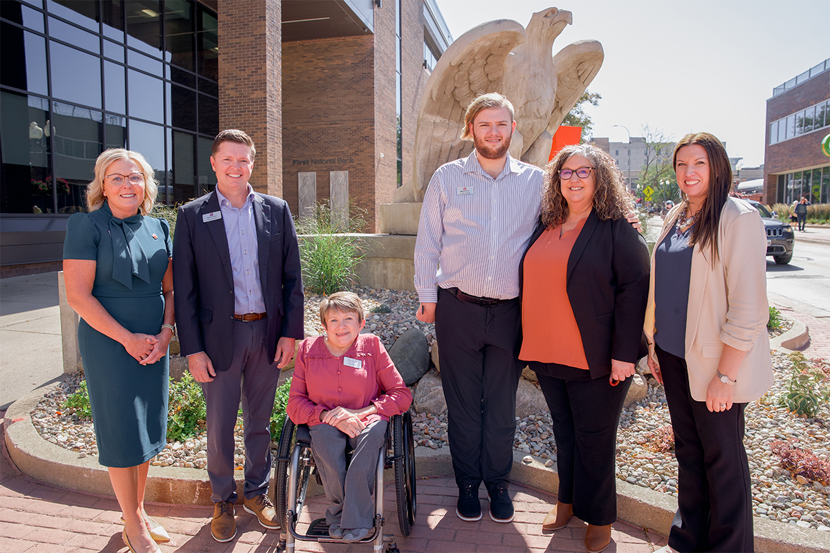 Landon Wagner with Vicki Stewart and members of the First National Bank team.