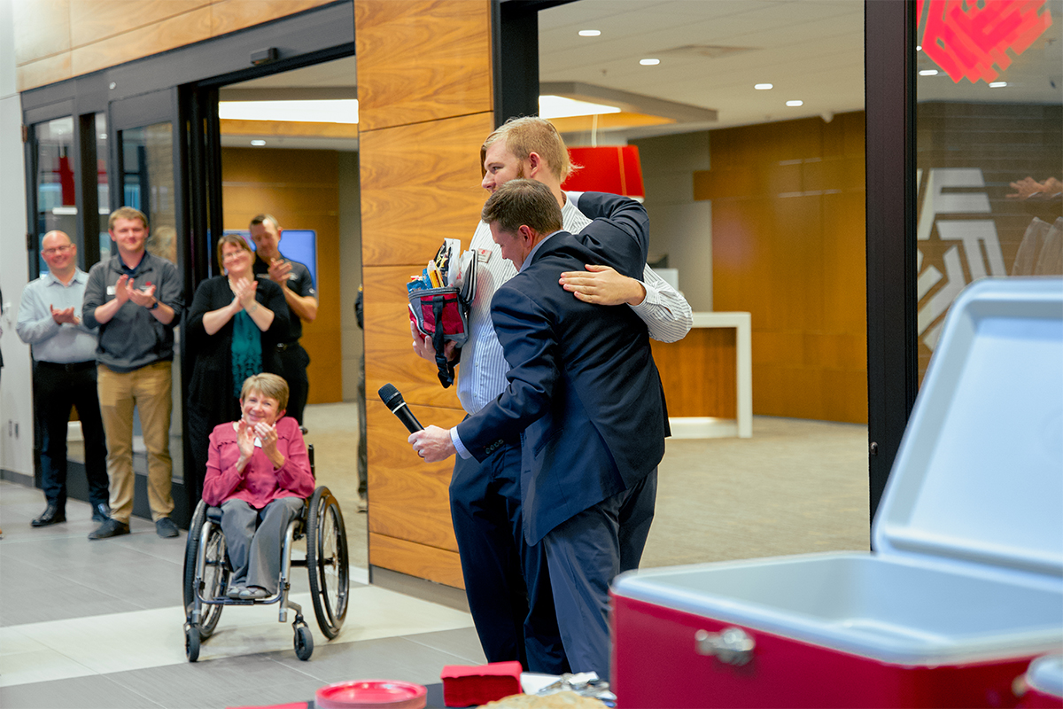 Chris Ekstrum and Landon Wagner hug after receiving the Disability Inclusion Partner award.