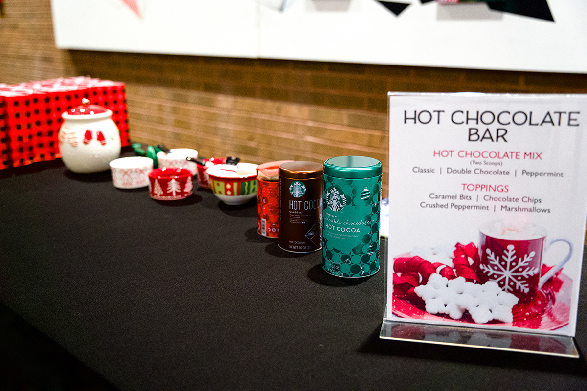 A hot chocolate bar with multiple cocoa mix and topping options.