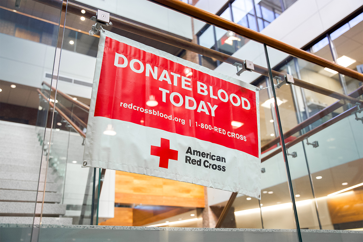 An American Red Cross banner that reads "Donate Blood Today."