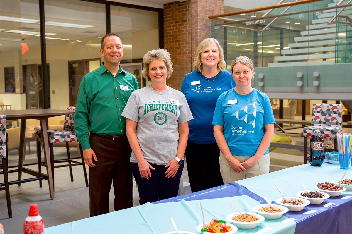 Junior Achievement volunteers hosting an ice cream social.