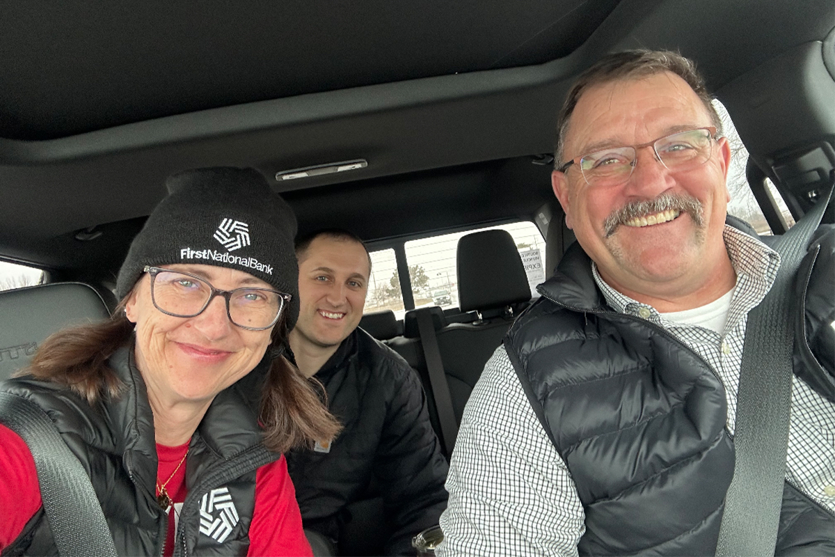 First National Bank teammates in a car volunteering for Sioux Falls Cares.