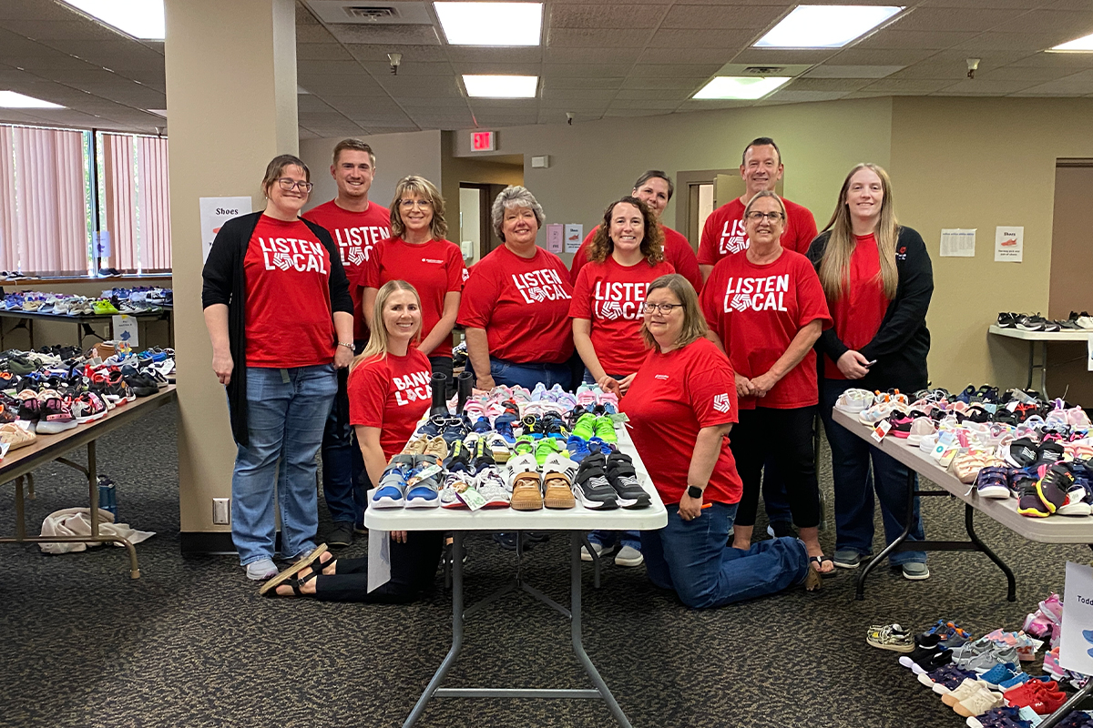 A group of First National Bank teammates volunteering at The Foster Network.