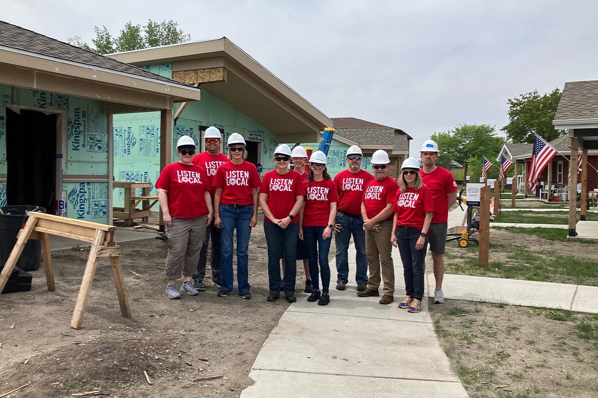 A group of First National Bank teammates volunteering at the Veterans Community Project.