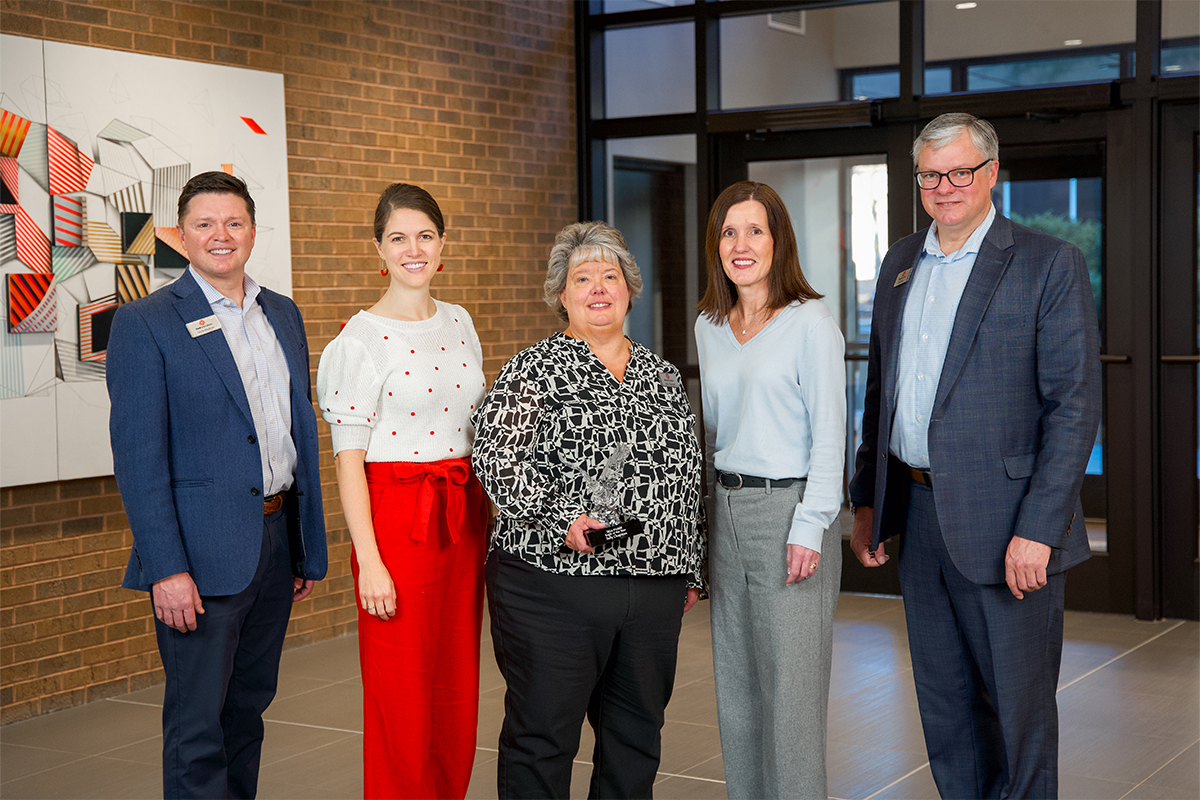 Sally Chapman with members of First National Bank's board of directors.