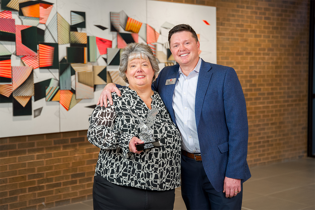 Sally Chapman with First National Bank President and CEO Chris Ekstrum.